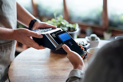 customer paying with their mobile wallet